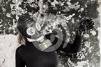 The girl in a gas mask. The threat of ecology. Stock Photo